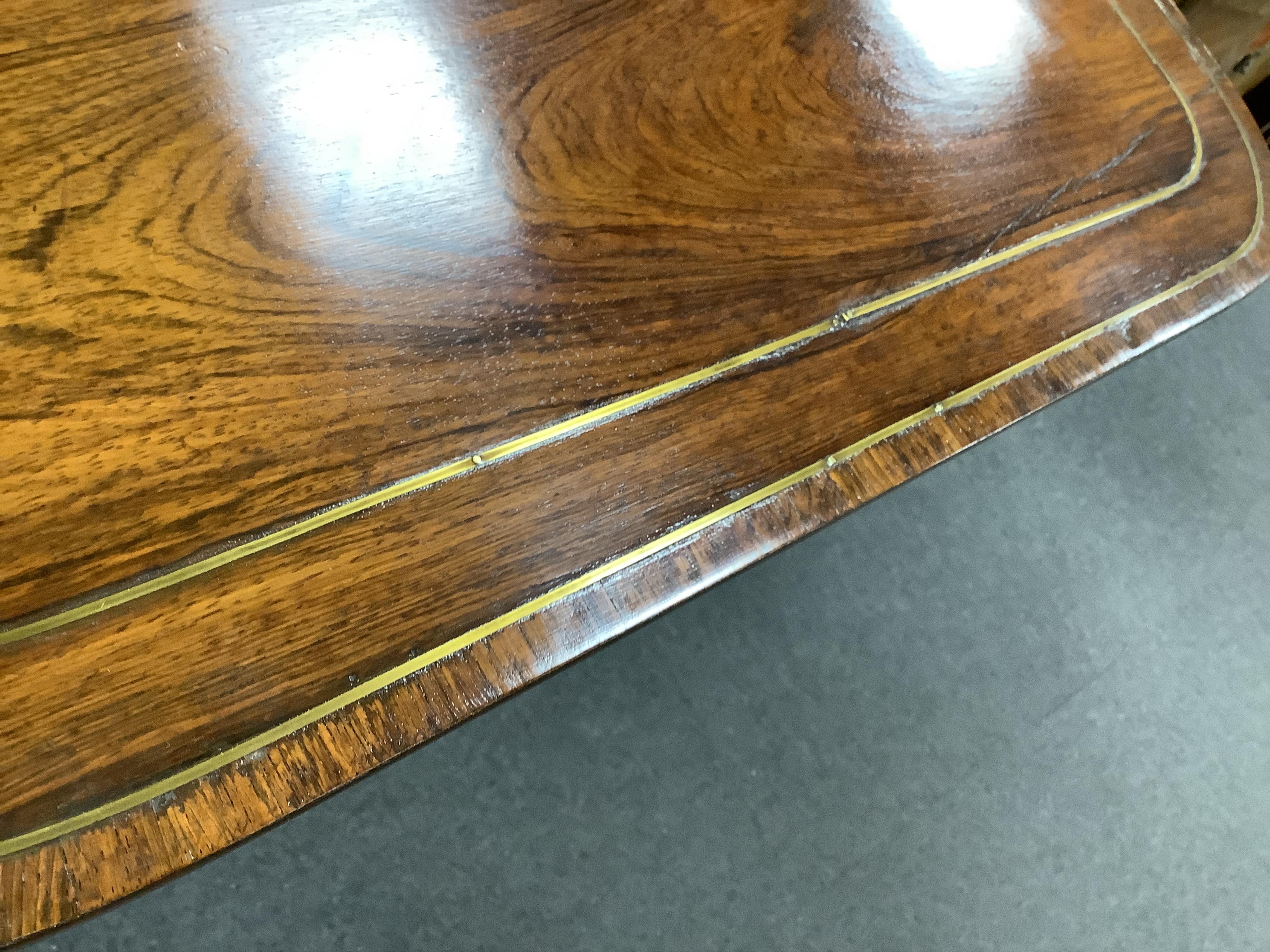 A Regency brass mounted rosewood sofa table, width 91cm, depth 66cm, height 70cm